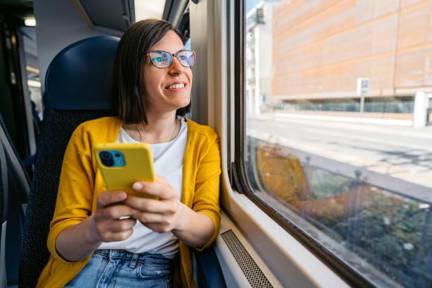 istock Young Woman Using Phone On The Train In Milan 1462201391