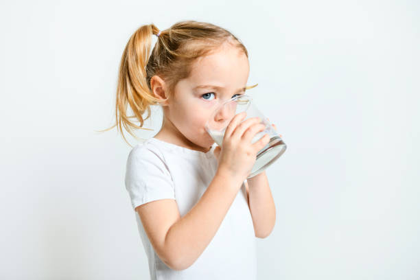 istock Image of child drinking milk on white background 1462201534