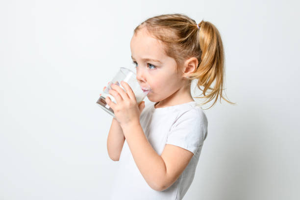 istock Image of child drinking milk on white background 1462201544