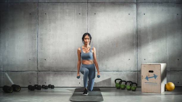 istock Online Workout Service: Portrait of Female Trainer Exercises, Video Tutorial, Virtual Training. Strong Fit Asian Woman Coach Teaching, Talking, Showing, How to do Aerobics, Yoga, Mindful Meditation 1462202375