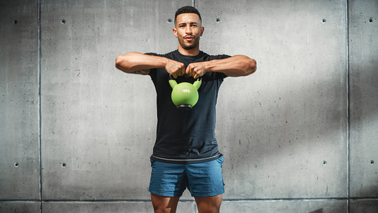 Online Workout Service: Professional Trainer Explaining Exercise, Video Tutorial, Virtual Training. Handsome Black Athletic Coach Teaching, Showing How to Use Kettlebell. Screen Replacement