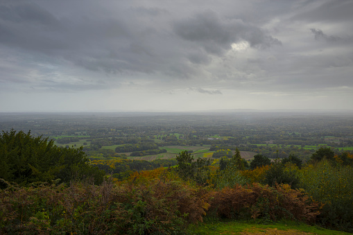 A view from Leith Hill in Surrey towards the South Downs in West Sussex on a grey autumn day.