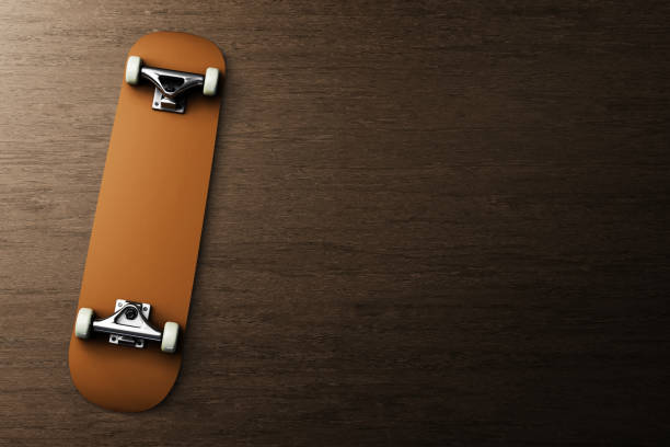 istock Top view skateboard on wood background 3d illustration 1462203996