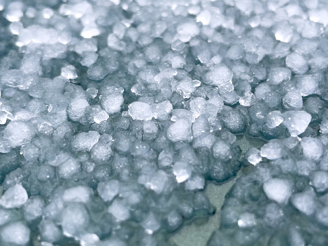 Large hailstones on a dark background. background, texture. Close-up.