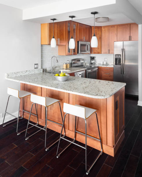 istock A kitchen with wood cabinets and granite countertop. 1462209447