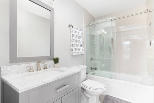 istock A bathroom with a grey cabinet and tiled shower. 1462209468