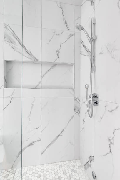istock A walk-in shower with marble and hexagon tiles. 1462209521