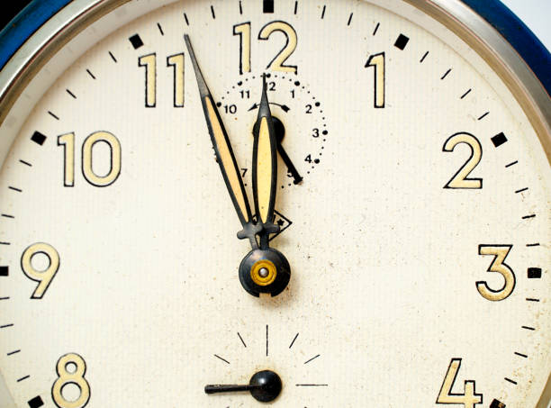 istock retro alarm clock on isolated background. 1462212682