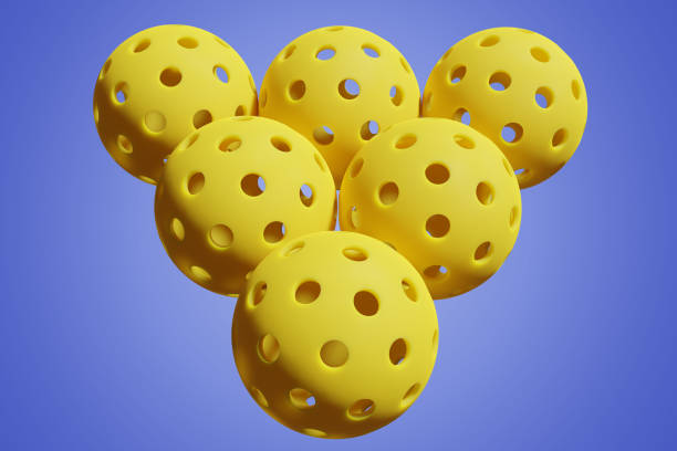 istock Pickleball six yellow balls on an isolated background. Close-up 3D rendering 1462212977