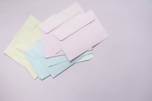 istock colorful envelope on pink background with copy space. 1462213169