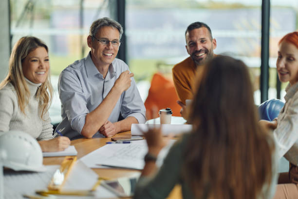 istock Happy architects talking on a meeting in the office. 1462216402