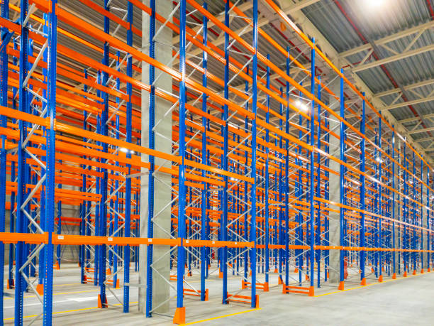 istock Business distribution and warehouse technology concept background, huge distribution new empty warehouse with high shelves, Interior of a modern warehouse storage of retail shop. 1462216788