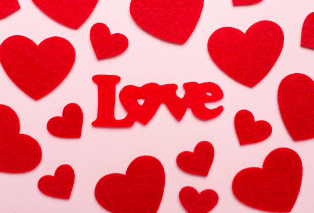 istock Felt word love with hearts on color background, top view 1462217343