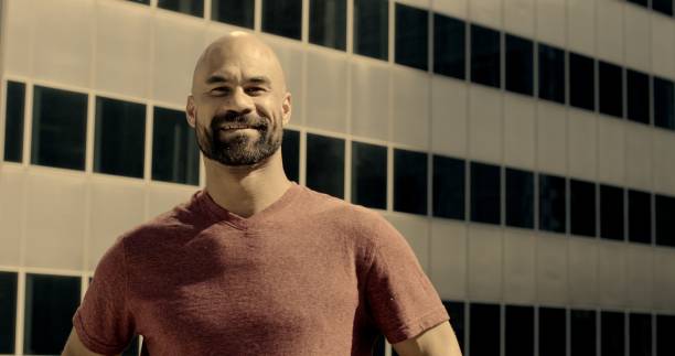 istock Mixed race man looking around in large city location 1462217995