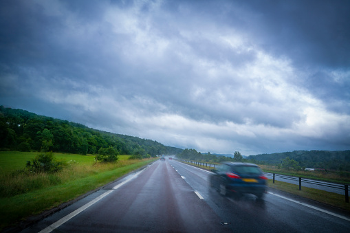 Rainy day driving in foggy road in UK United Kingdom in a cloudy evening