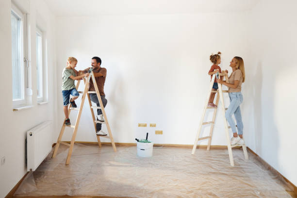 istock Happy family talking during home renovation process. 1462218750