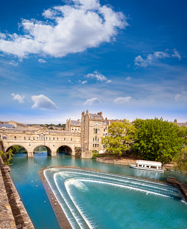 Bath Pulteney Bridge Poulteney over River Avon in the county of Somerset, England UK. Bath became popular as a spa town with the Roman Baths thanks to hot springs.