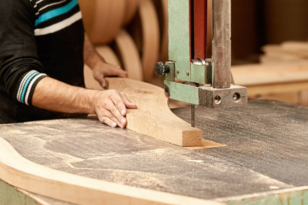 istock A male carpenter cuts a wooden board 1462219058