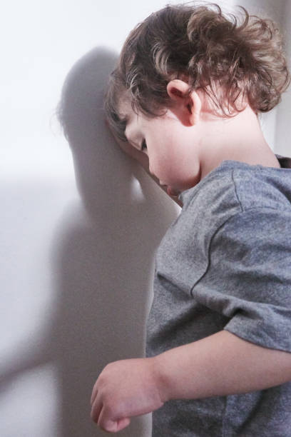 istock Toddler standing against wall 1462227796