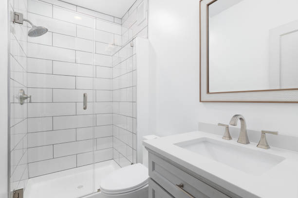 istock A bathroom with a grey cabinet and tiled shower. 1462228144