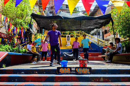 medellin, colombia. 20th august, 2022: hip hop troupe is performing in a street of comuna 13, colombia