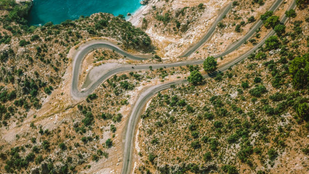 istock curvy road by the sea 1462240311