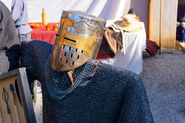 istock Medieval helmet and chain mail armor at a medieval party 1462259155