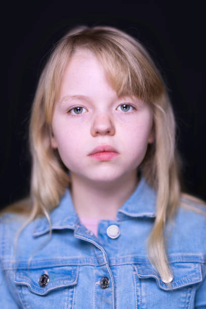 istock Blonde girl aged 10 wearing a denim jacket 1462260770