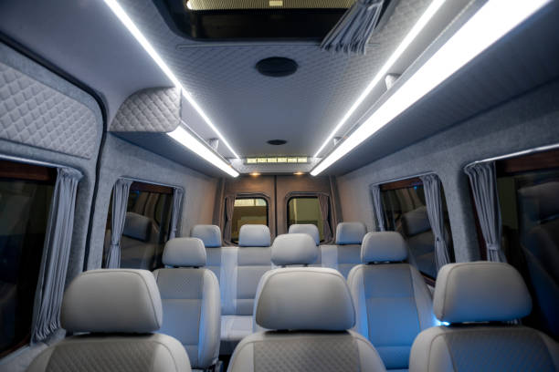 istock Comfortable interior of a passenger bus with soft seats 1462261354