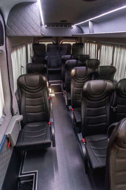 istock Comfortable interior of a passenger bus with soft seats 1462263259