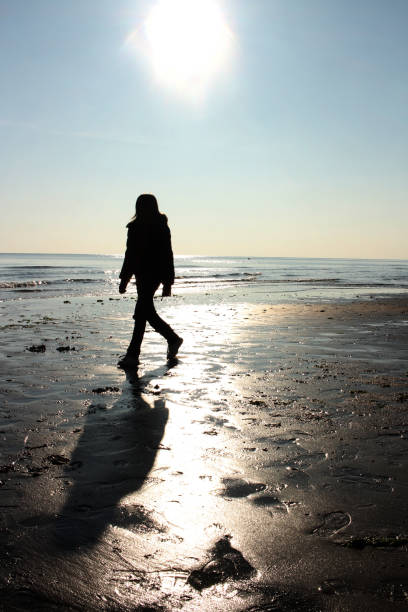 person walks along the  oasi-naturalistica-di-vallevecchia (Brussa). Oasis and natural beach in Caorle, a city near Venice (Italy)