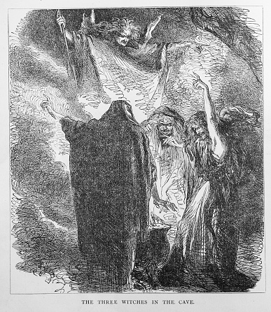 Sandwich, Massachusetts, USA - October 13, 2022-  Engraving of  three witches around a bubbling cauldron in a cave summoning an apparition of a  rising demon in the background recalling a scene from Shakespeare's Macbeth..Image found in an 1881  book: 