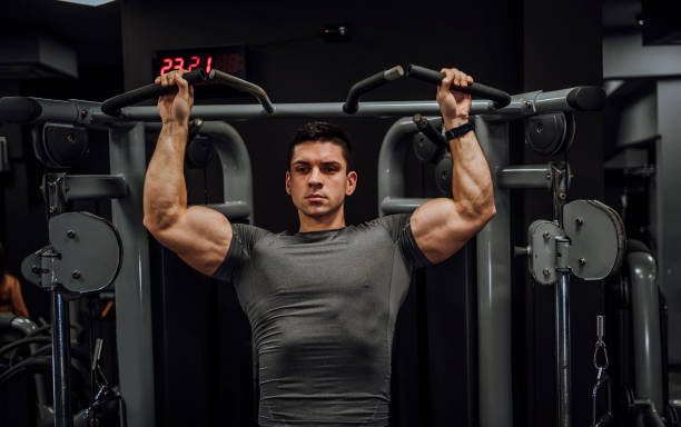 istock Young man training in the gym 1462277506