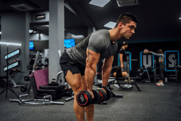 istock Young man training in the gym 1462280647