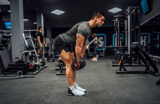 istock Young man training in the gym 1462280825