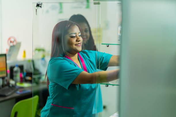 istock Female receptionists employed by a beauty spa, are inside the premises for which they work, together organizing the products they have for sale 1462284695