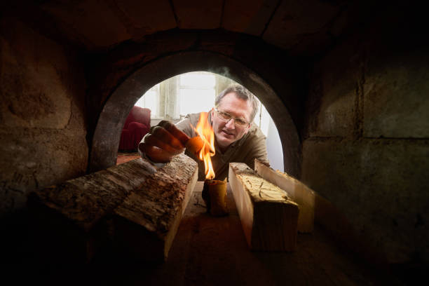 istock Kindling wood burning stove during heating season. 1462287056