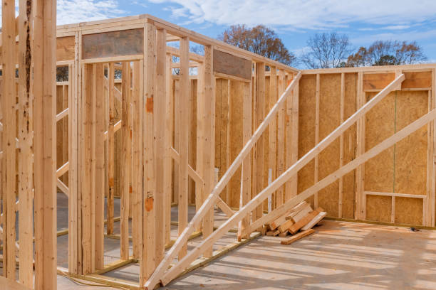 istock A timber frame house of wooden beam framework on stick built home under construction new build 1462297036