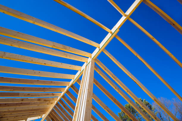 istock An construct a wooden roof beam from a framework of trusses and frames for a newly constructed stick house 1462297073