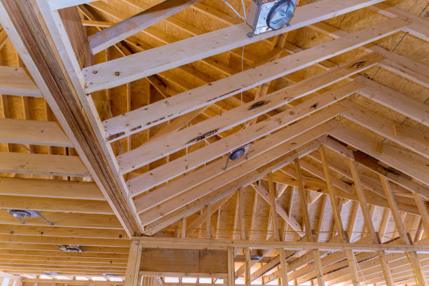 istock Installation of a spotlight lamp lighting system in new home construction by mounting it to the ceiling and installing the lighting lamp 1462297090
