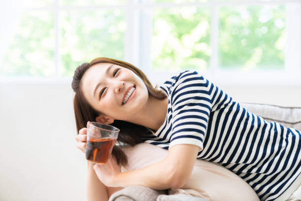 istock attractive asian woman who drink tea 1462322979
