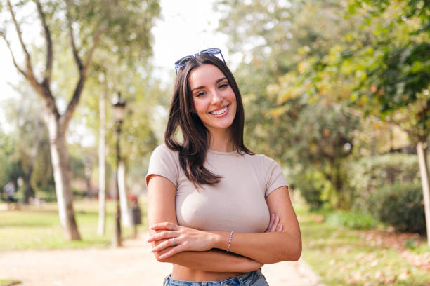 istock woman with arms crossed looking at camera smiling 1462385160