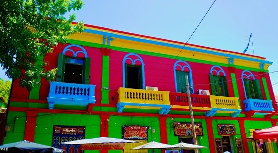 Buenos Aires, Argentina: December 19, 2022 -  La Boca the Buenos Aires neighborhood famous for its colorful houses, is popular destinations for tourist visiting Argentina. Besides the multicolored buildings, there is Caninito, the pedestrian street.
