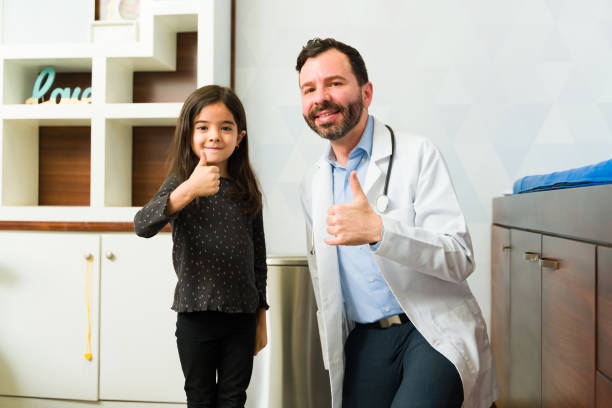istock Positive pediatrician doctor happy with a kid 1462386152
