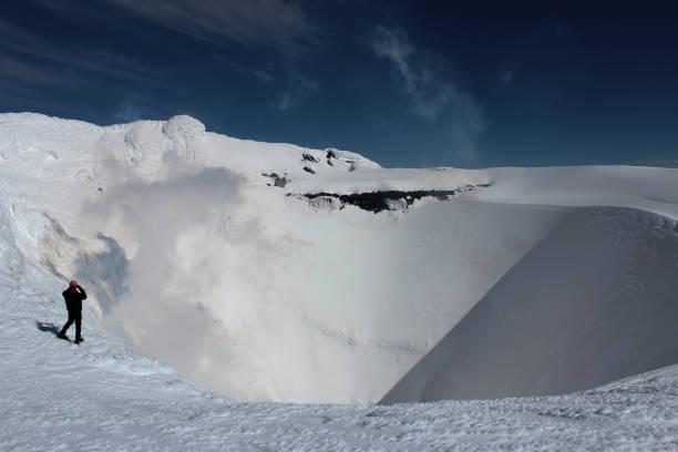 Pucon, Chile - august, 16, 2013-\nVillarrica volcano crater being observed up close by a climber