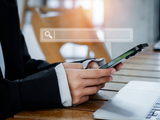 istock Search engine bar with blank space for text on smart mobile phone using by businessperson. Data search technology optimization for information on website. Job searching on browsing internet concept. 1462398170