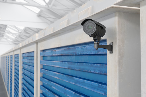 Close-up View Of Security Camera In Storage Room Wall