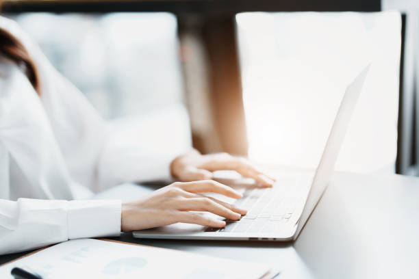 istock Portrait of a business woman working on a computer at work 1462424624