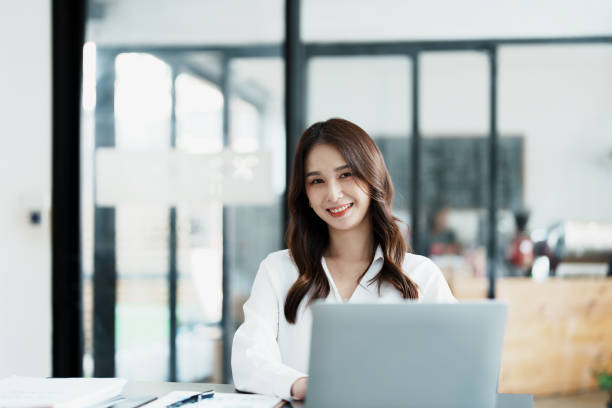 istock Portrait of a business woman working on a computer at work 1462424649