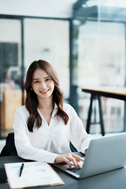 istock Portrait of a business woman working on a computer at work 1462424776